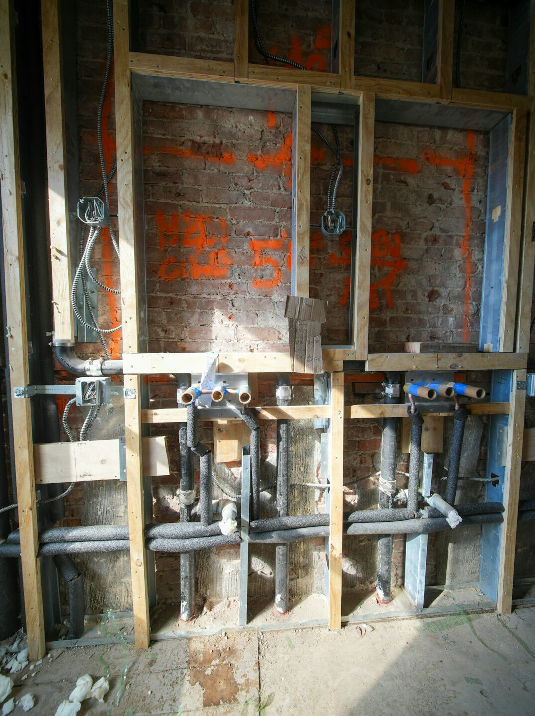 homeowner checking pipes